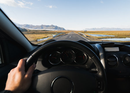 View from driver's seat over the coastal road at the South of Iceland.の写真素材