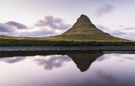 Reflection of Kirkjufell moutain in the water at sunset, Snaefellsnes peninsula, Iceland.の写真素材