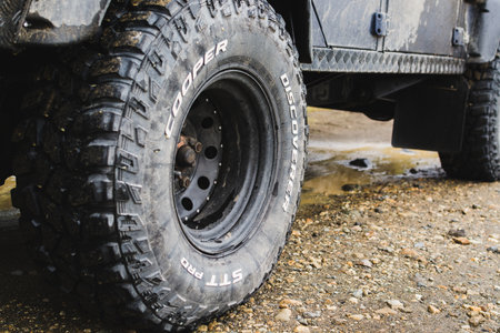 LANDMANNALAUGAR, ICELAND - AUGUST 2018: close-up of car all-terrain tires on the mud road.のeditorial素材