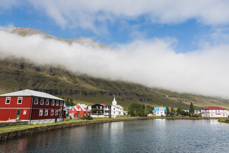 SEYDISFJORDUR, ICELAND - AUGUST 2018: waterfront view of the timbered houses in the old town.のeditorial素材