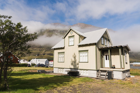 SEYDISFJORDUR, ICELAND - AUGUST 2018: authentic Icelandic residential house. Wide angle lens shot, sunny day.のeditorial素材