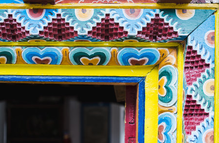 Detail of a carving ornament on a wall in Nepalese Buddhist monasteryの写真素材