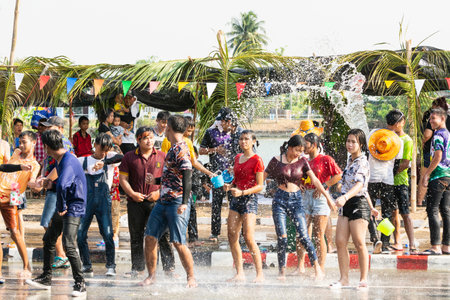 SUKHOTHAI, THAILAND - 13 APRIL 2019: Thai people celebrating New Year Songkran Water Festival on the street.のeditorial素材