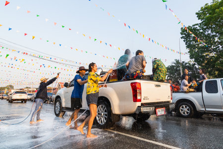 SUKHOTHAI, THAILAND - 13 APRIL 2019: Thai people celebrating New Year Songkran Water Festival on the street.のeditorial素材