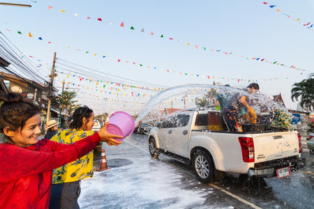 SUKHOTHAI, THAILAND - 13 APRIL 2019: Thai people celebrating New Year Songkran Water Festival on the street.のeditorial素材
