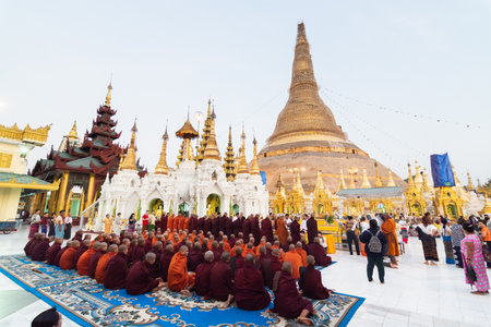 Yangon, Myanmar - March 2019: Buddhist monks during the official alms giving ceremony at Shwedagon pagoda.のeditorial素材