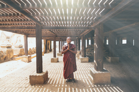 Bagan, Myanmar - March 2019: Burmese Buddhist monk praying in a monastery on a sunny dayのeditorial素材