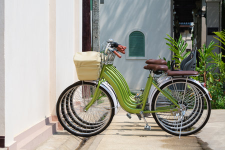Green city bicycles parked next to the rental shop in Luang Prabang, Laos.の写真素材