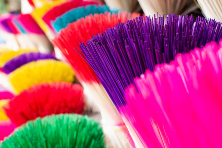 Closeup on bundles of traditional colorful Vietnamese incense sticks at the workshop in a village close to Hue city, Vietnamの写真素材