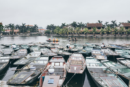 Ninh Binh, Vietnam - May 2019: tourists on a boat tour in Trang An nature water-land parkのeditorial素材