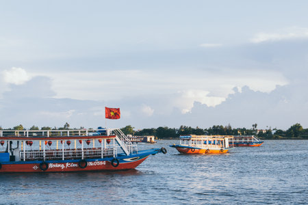 Hoi An, Vietnam - June 2019: colorful Vietnamese tourist boat sailing on Thu Bon riverのeditorial素材