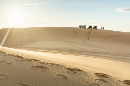 Mui Ne, Vietnam - June 2019: people riding off-road cars in Bau Trang white sand dunes.のeditorial素材