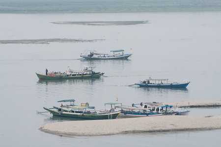Bagan, Myanmar - March 2019: boats on Irrawaddy river at sunriseのeditorial素材