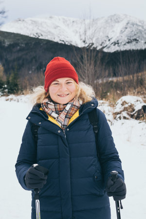 Woman trekking in snowy High Tatra mountains in winter, Slovakiaの写真素材