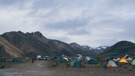 Landmannalaugar, Iceland - August 2018: panoramic view over the camping site with tents and campers in the mountain valleyのeditorial素材
