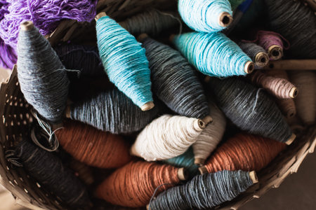 Vintage filling carriers of the loom with spool of colorful threads inside
