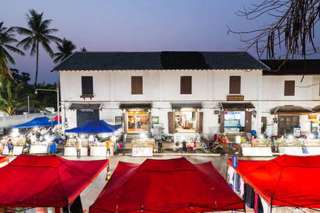 Luang Prabang, Laos - May 2019: night market street with food stalls and souvenir vendorsのeditorial素材