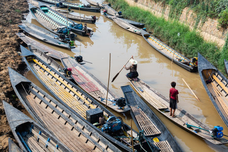 Maing Thauk, Myanmar - April 2019: people at traditional Burmese floating market on waters of Inle lake.のeditorial素材