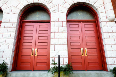 the red couple door on the building with little plantの写真素材