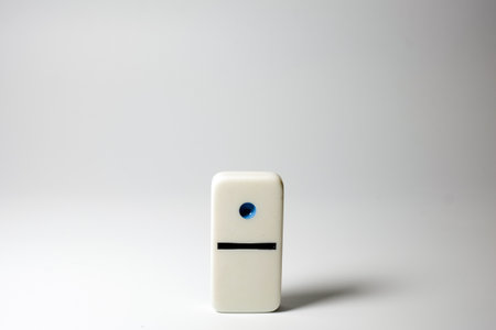 the single one dot domino standing aloneの写真素材
