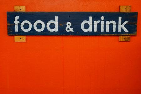 Wooden Food and drink sign on red wallの写真素材