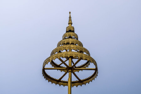 golden umbrella in temple with blue sky