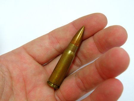 ak 47 7,65 mm cartidge in handの写真素材