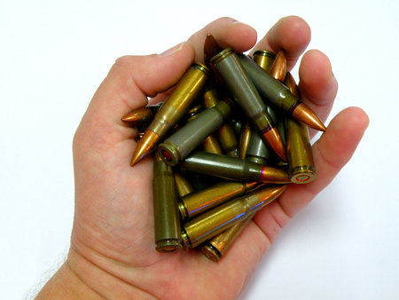 ak 47 cartridges in hand 7,65 mm