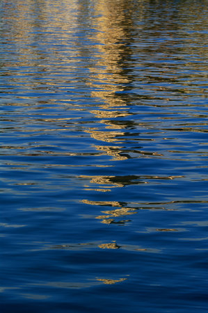 Reflection of church tower in the sea waterの写真素材