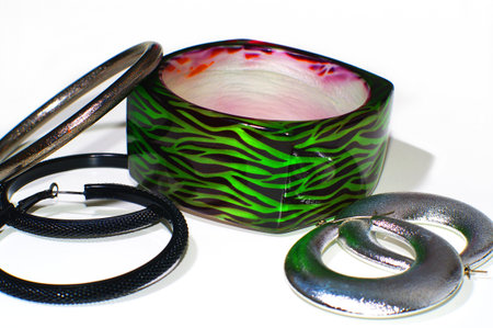 Female bracelets with earrings isolated on whiteの写真素材