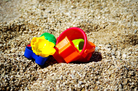 Children beach toys on the pebbles beachの写真素材