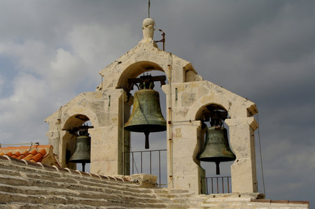 Thre old bells on "fortres" church in Vrboska Croatiaの写真素材