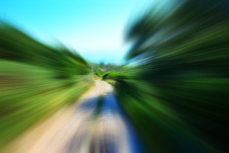 Mountain bike driving on country roadの写真素材