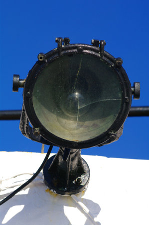 Old ships black spotlight with broken glassの写真素材