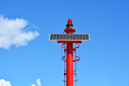 Solar powered small red lighthouse in the Adriatic seaの写真素材