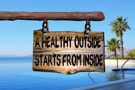 Health sign on old wood with a blurred seascape on backgroundの写真素材