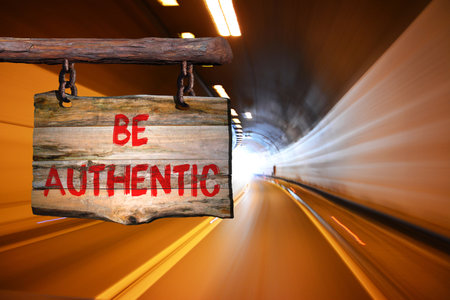 Be authentic sign with blurred backgroundの写真素材
