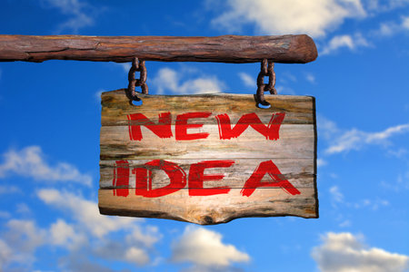 New idea motivational phrase sign on old wood with blurred backgroundの写真素材