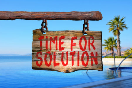 Time for solution motivational phrase sign on old wood with blurred backgroundの写真素材