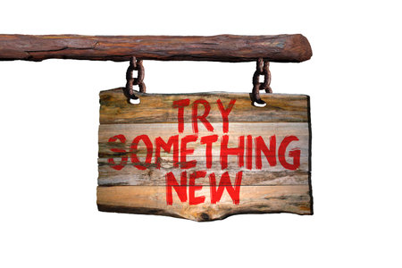 Try something new motivational phrase sign on old wood with blurred backgroundの写真素材