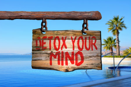 Detox your mind motivational phrase sign on old wood with blurred backgroundの写真素材