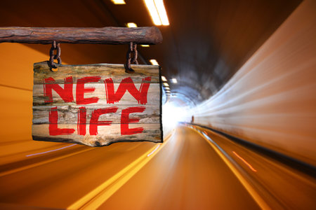 New life motivational phrase sign on old wood with blurred backgroundの写真素材