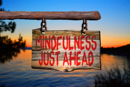 Mindfulness just ahead motivational phrase sign on old wood with blurred backgroundの写真素材