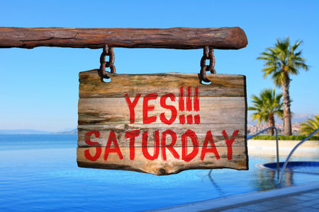 Yes!!! Saturday motivational phrase sign on old wood with blurred backgroundの写真素材