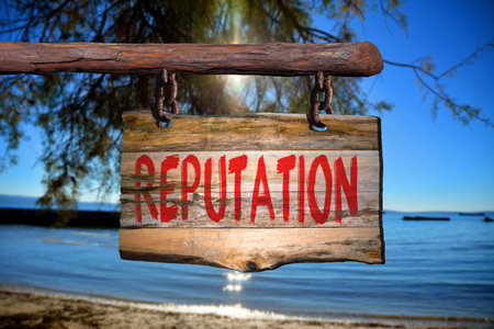 Reputation motivational phrase sign on old wood with blurred backgroundの写真素材
