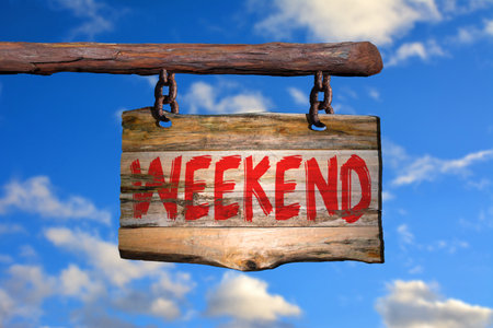 Weekend motivational phrase sign on old wood with blurred backgroundの写真素材