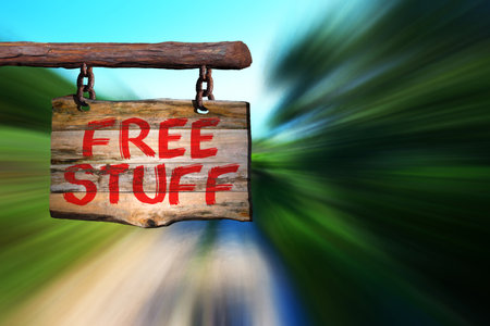 Free stuff motivational phrase sign on old wood with blurred backgroundの写真素材