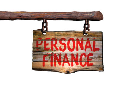 Personal finance motivational phrase sign on old wood with blurred backgroundの写真素材