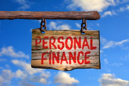 Personal finance motivational phrase sign on old wood with blurred backgroundの写真素材