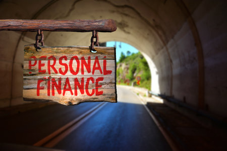 Personal finance motivational phrase sign on old wood with blurred backgroundの写真素材